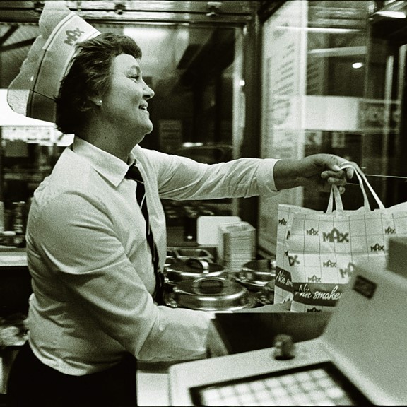 Retro image of staff handing over food